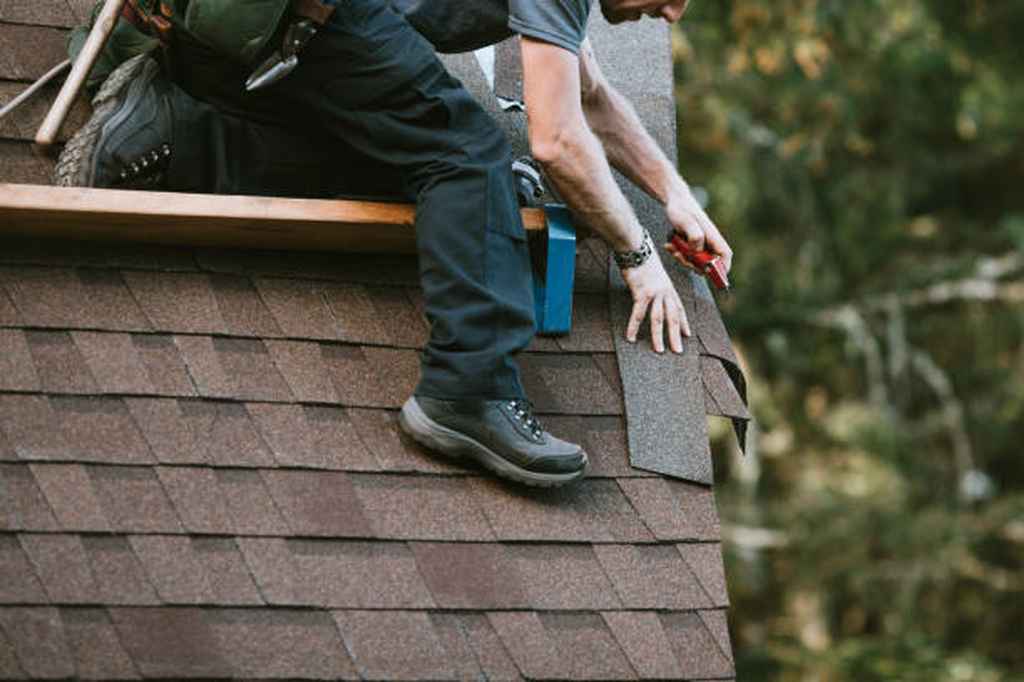 homeowner repairing asphalt shingle roof Plano